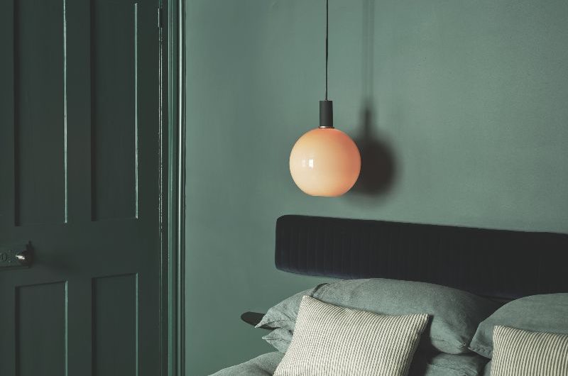 Colour drenched bedroom in green shades oozing a calm feeling.