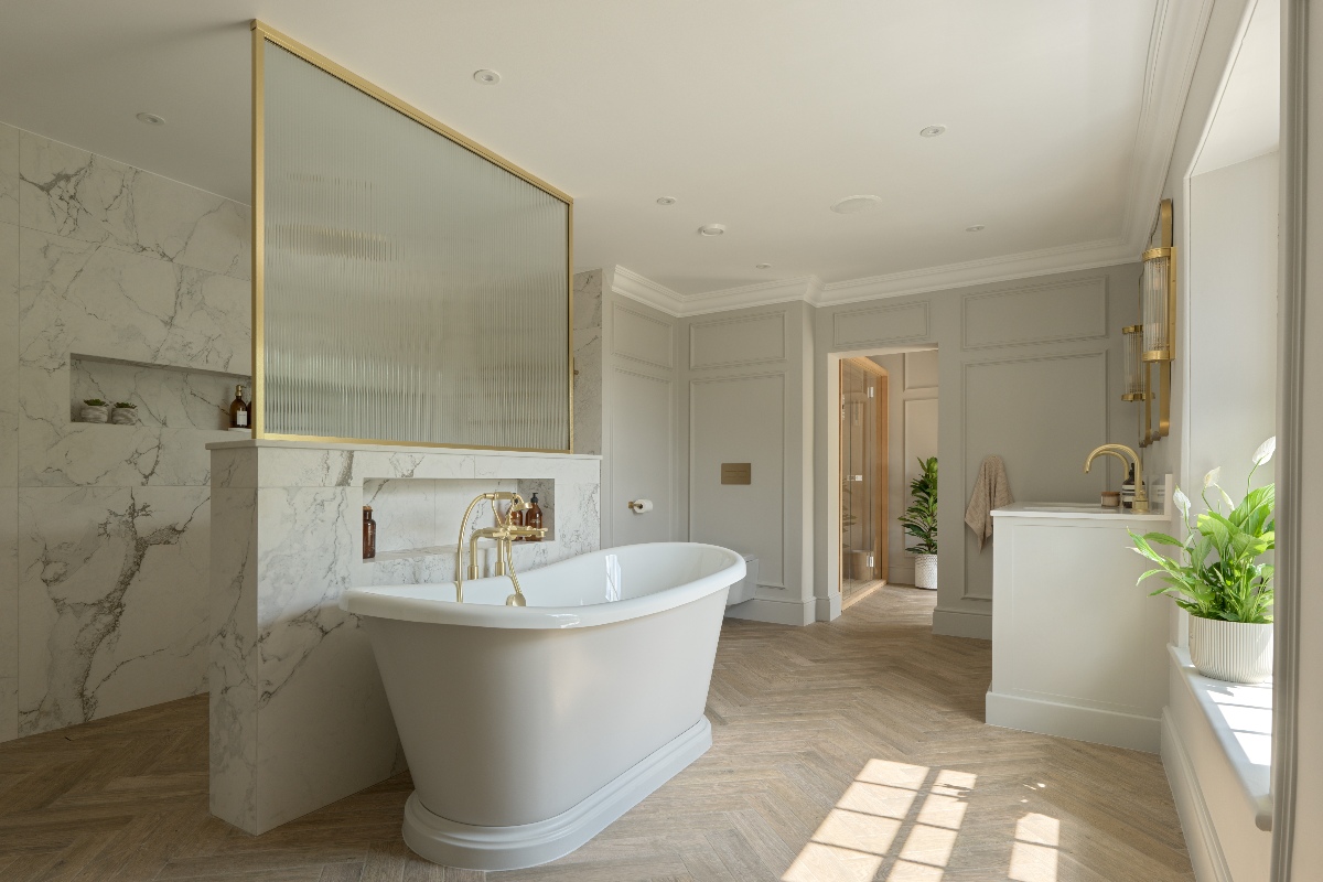 Ensuite design with an open shower area, freestanding bath, parquet flooring, wall panelling and an adjoining sauna zone.