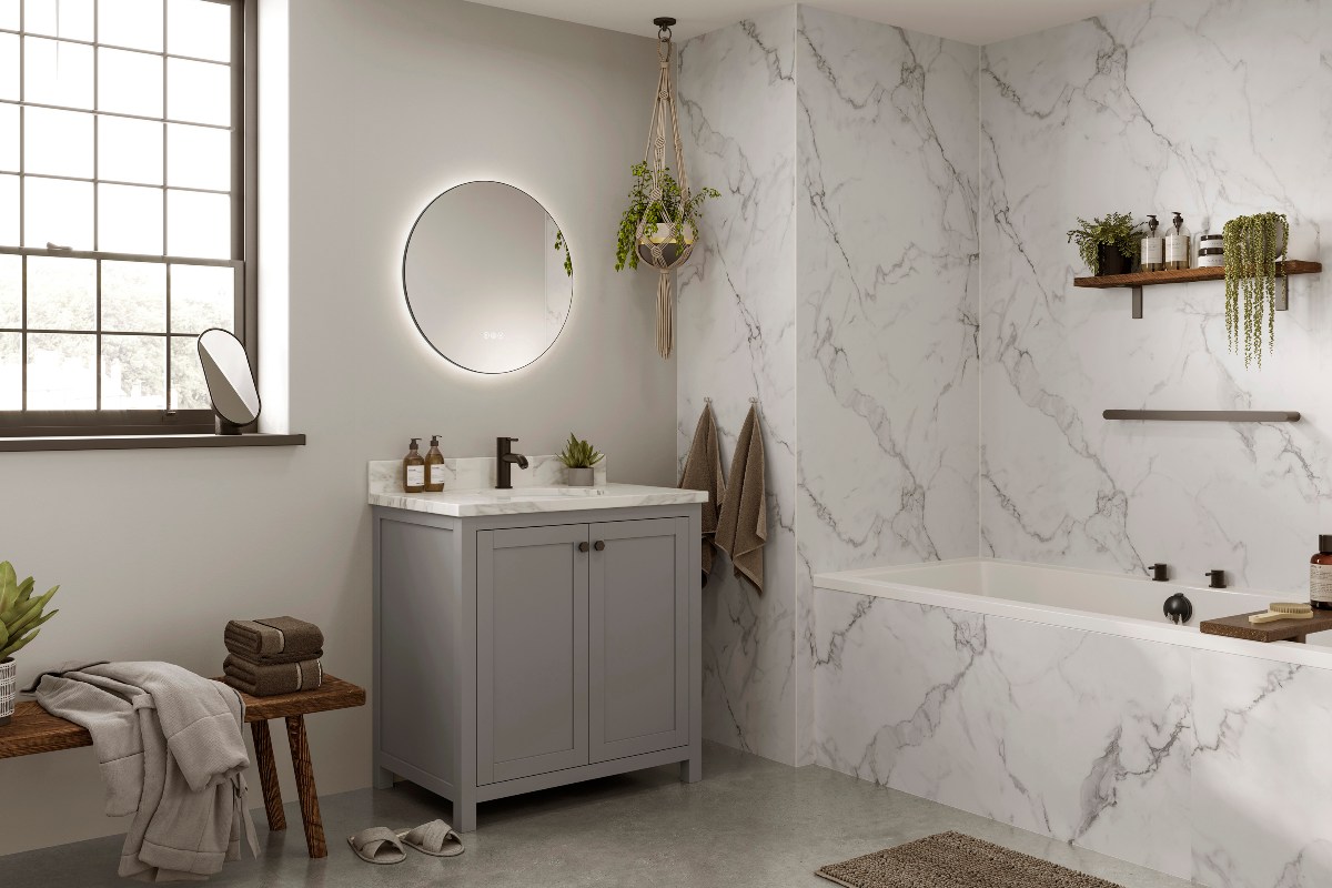 A modern scheme with a fitted tub, marbled surfaces, a grey vanity unit with an LED mirror above it and a large steel-framed window.
