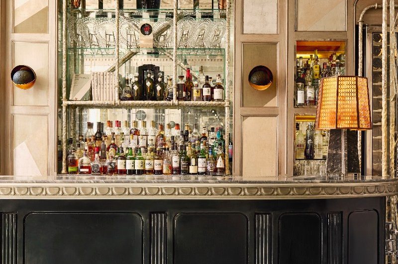 The Connaught bar with 1920s interiors, decorative wall panels, and a drinks display area.