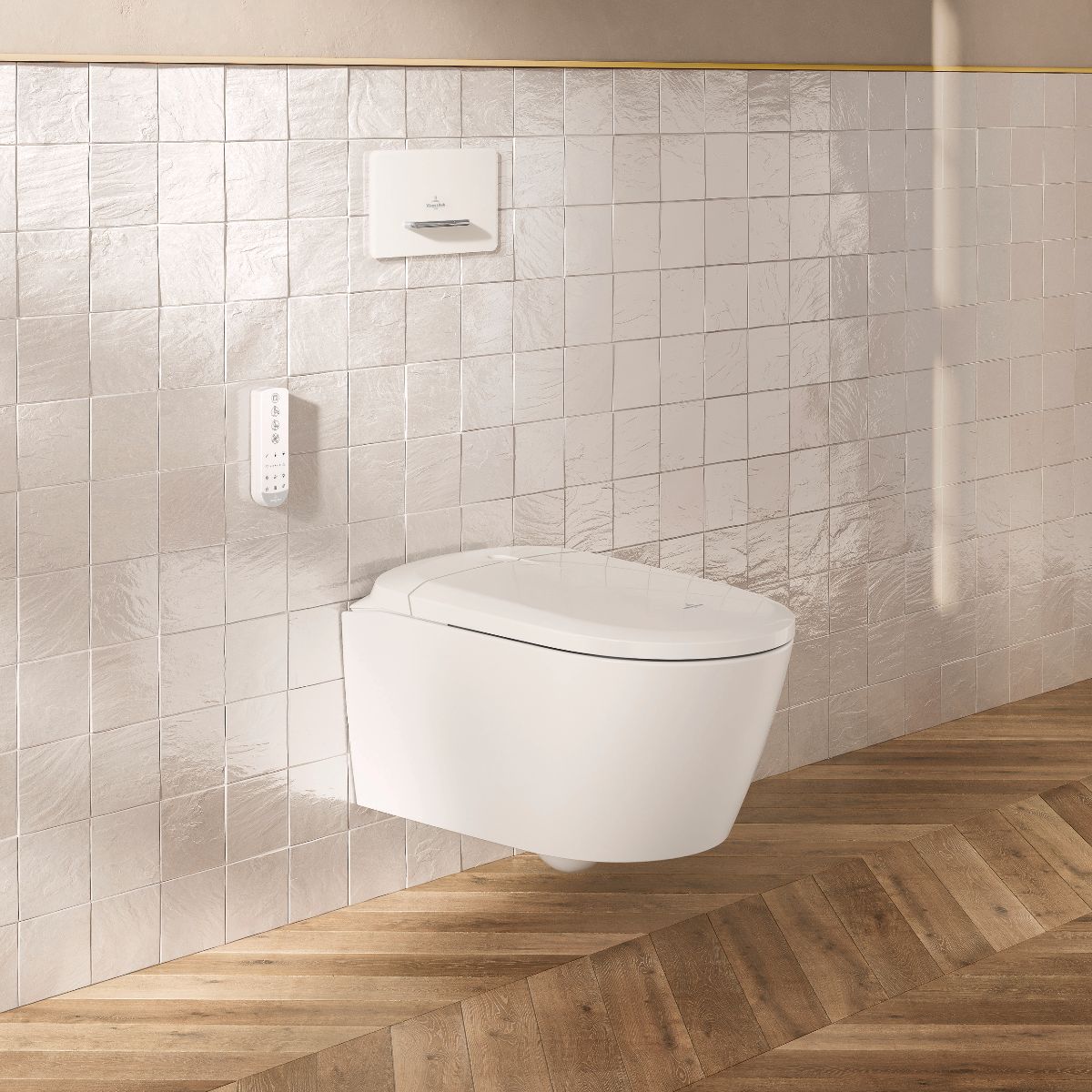 A minimalist bathroom with wood flooring, glossy wall tiles and a newly launched wall-mounted toilet.