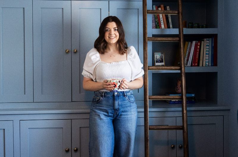 Homeowner posing in a home office.