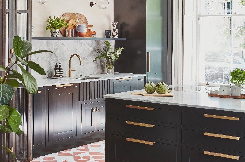 A fusion kitchen with a mix of flooring and cabinet styles.