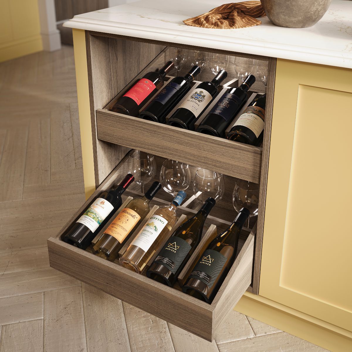 A yellow island with wood shelving for storing wine bottles and glasses.