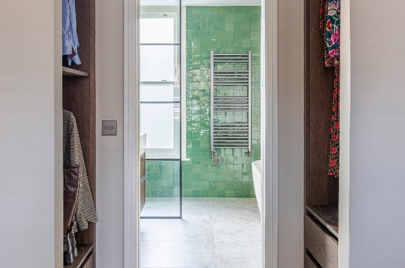 A look inside the ensuite through the wardrobe.