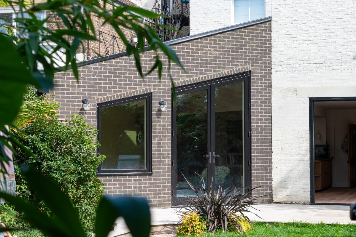 A property with an angled addition with a distinctive triangular roof.