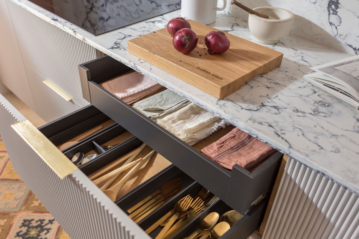 Drawers with dividers for linens and cutlery.