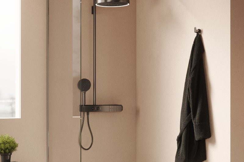 A neutral spa-like scheme with a smart shower, with a clear glass panel, and white shower tray.