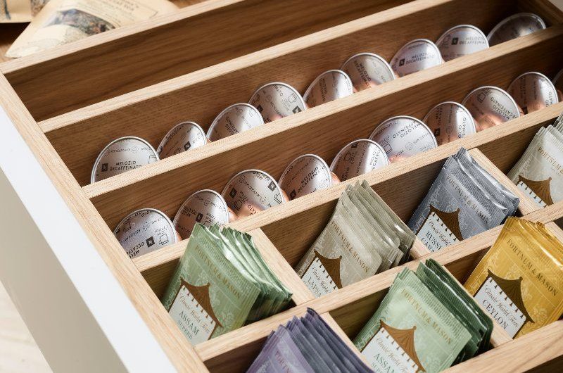 Drawer with compartments and tea bag storage.