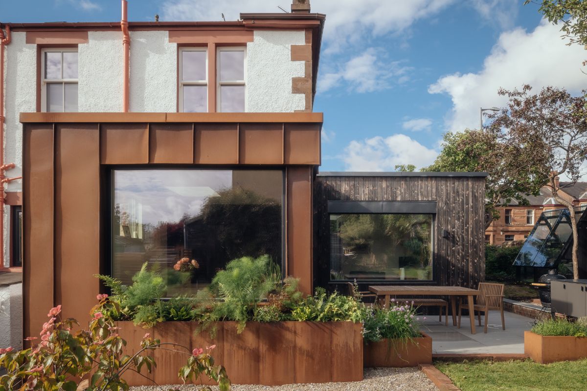 A 19th-century terrace in Glasgow with a side extension and an outdoor dining zone.