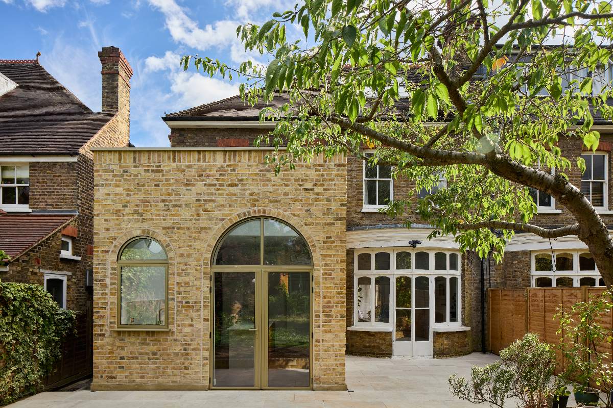 The view of a spacious property with a curved bay window in the reception room.