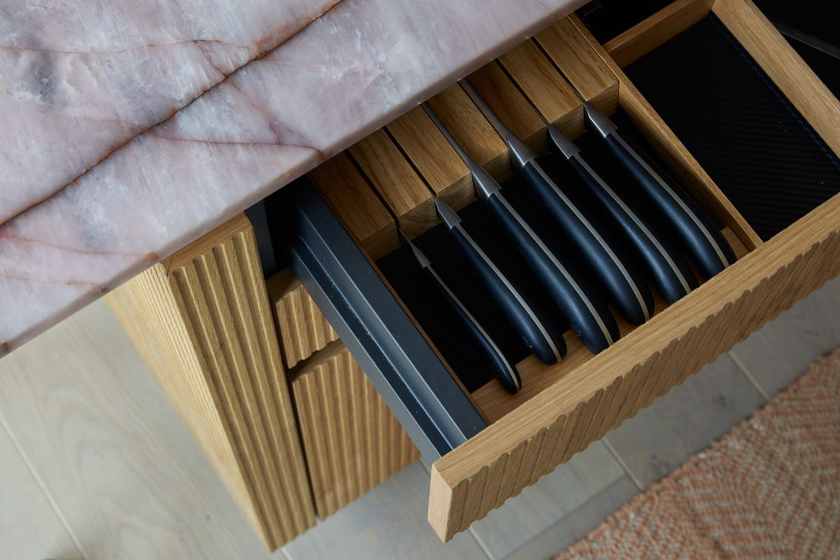 Island with a drawer with bespoke knife rack.