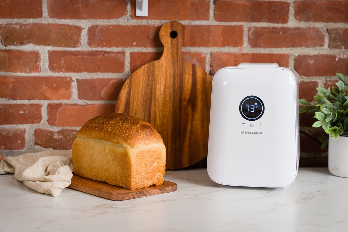 A sourdough bread starter appliance in an industrial style kitchen.