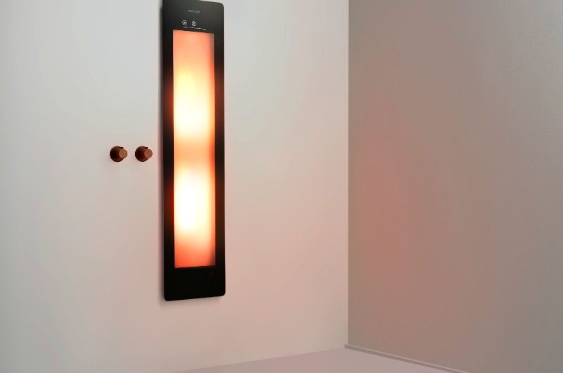 A sunshower with wellness benefits with a black frame and warming infrared.
