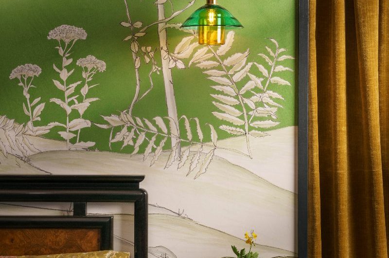 A zen sleep space with a Japandi mural, coloured glass light, and mustard furnishings.