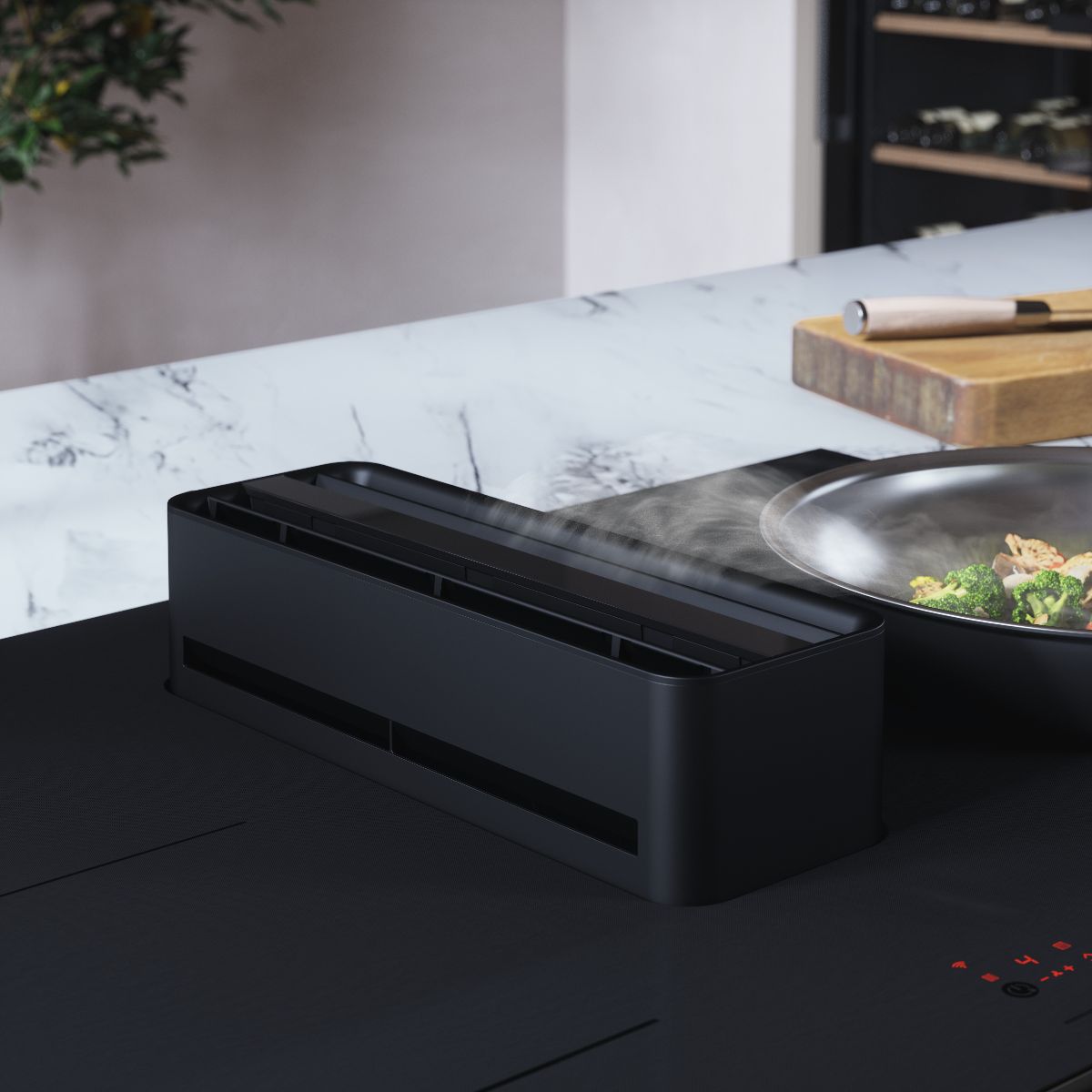 Closeup at a cooking appliance with integrated extractor.