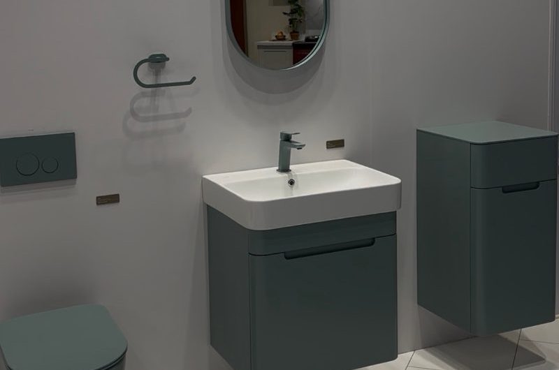 Colourful bathroom furniture and sanitaryware at an exposition.