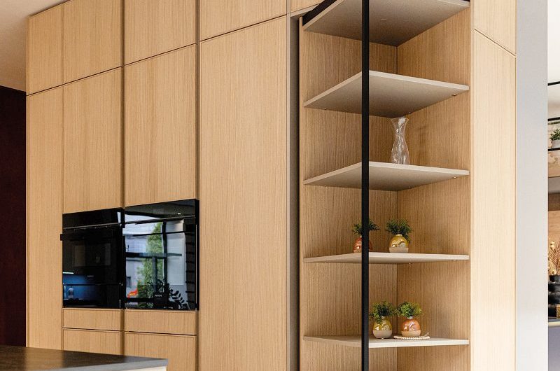 A sleek kitchen design with a clever spinning storage solution.