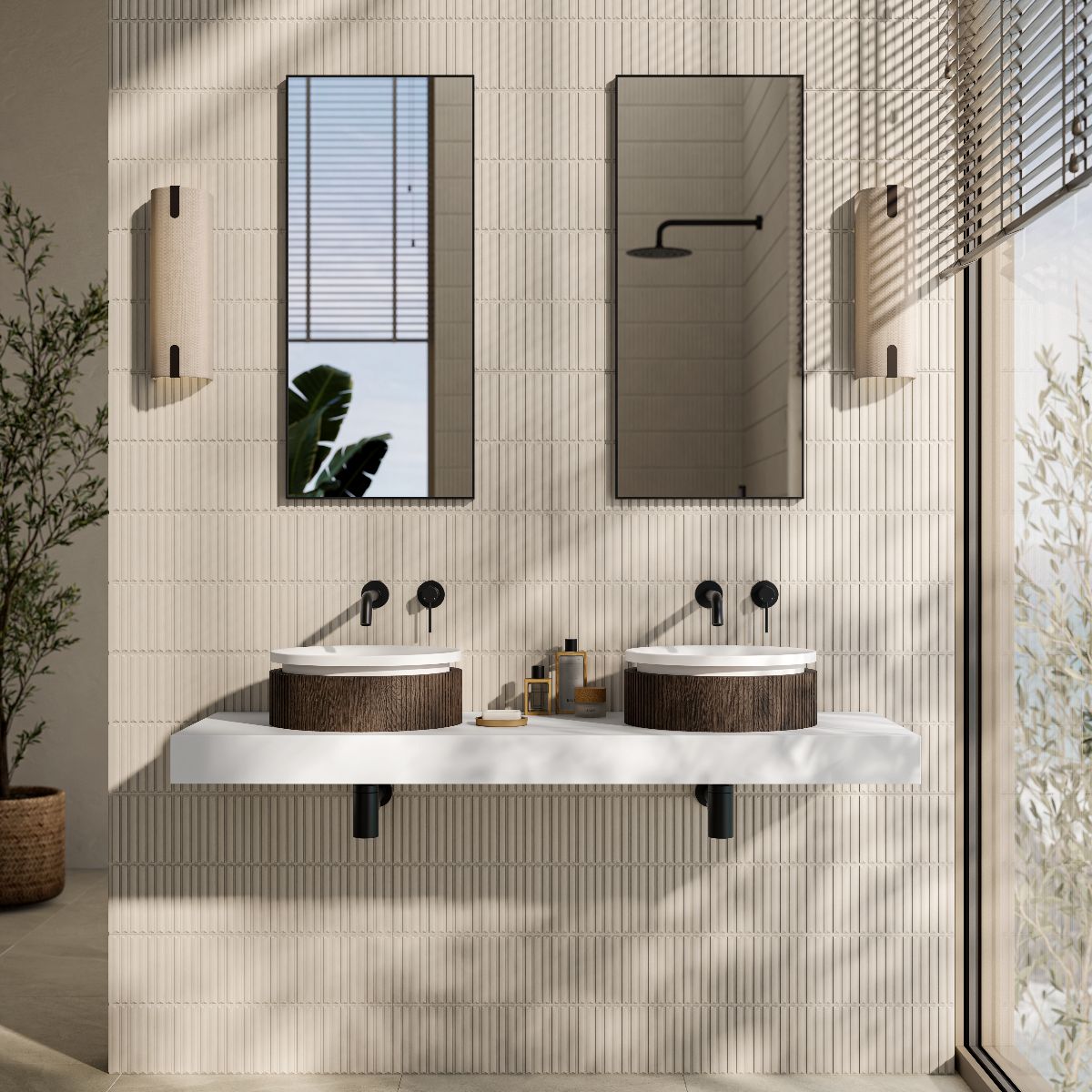 Closeup at a vanity zone with walnut countertop basins on a sleek wall-mounted countertop, with black brassware and fittings, and kit kat tiles on the back wall.