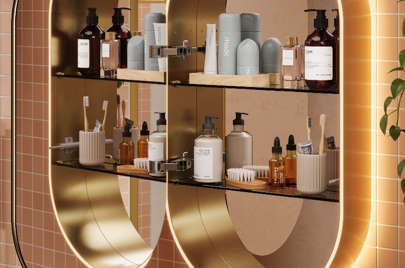 A mirrored cabinet with shelving and lighting in a colourful bathroom.