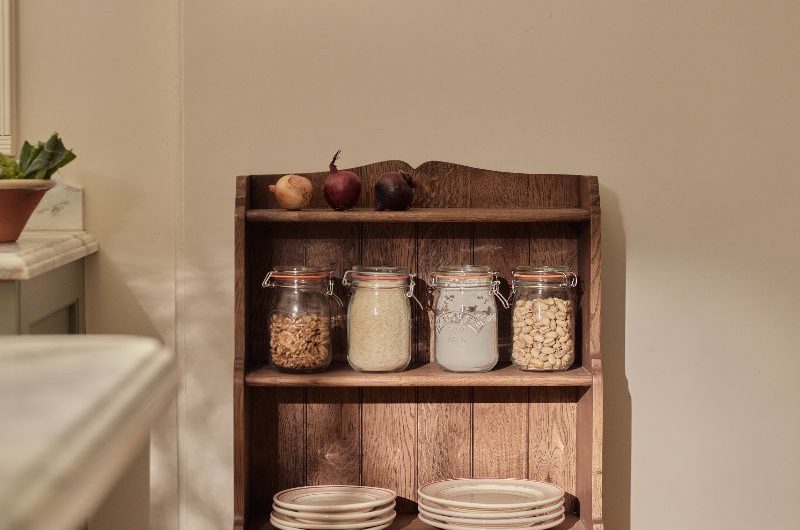 An oak bookcase in a classic kitchen.