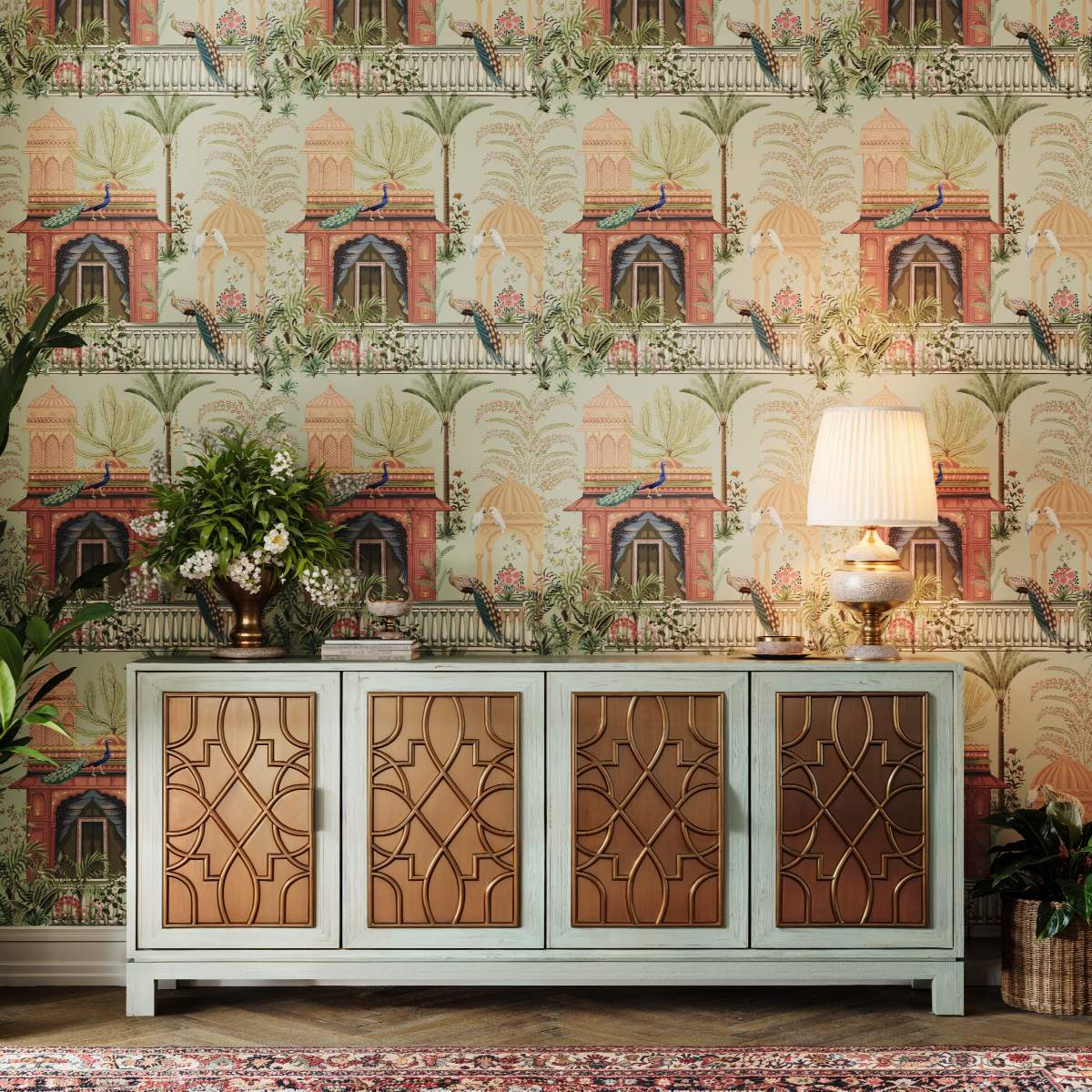 An intricate sideboard with an exotic wallpaper behind it.