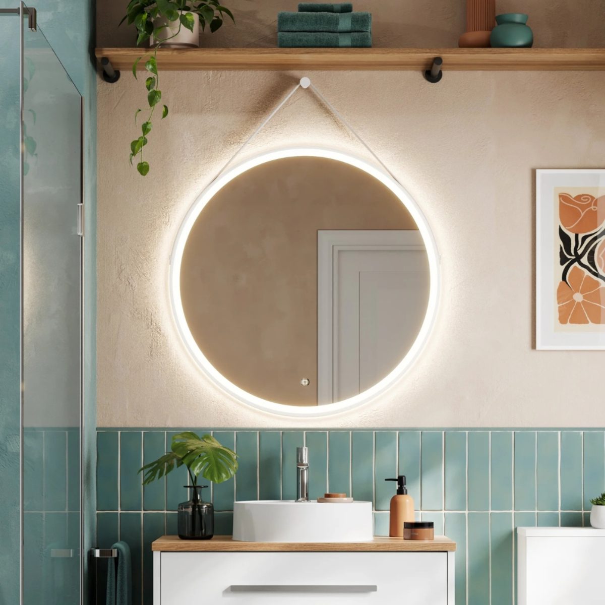 A colourful bathroom with turquoise tiles, a white vanity with round countertop, and an LED mirror.