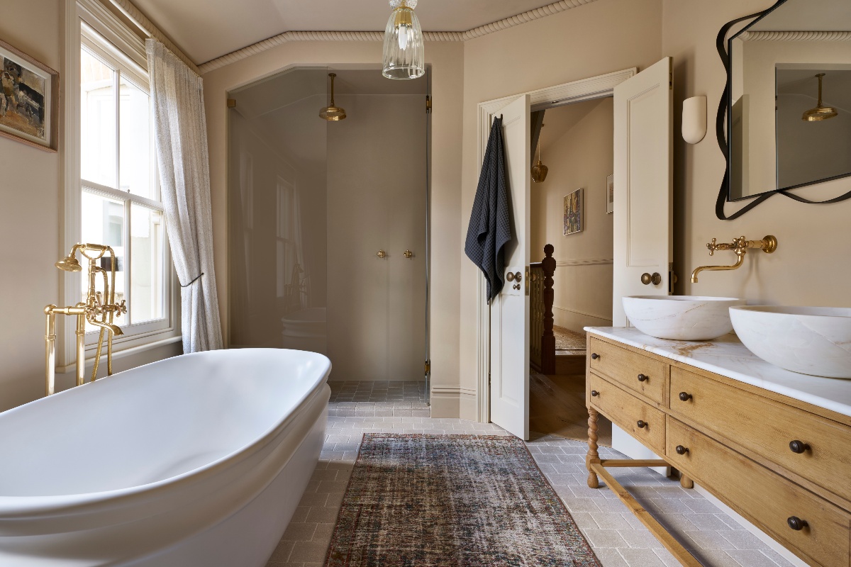 A luxury bathroom with a walk-in shower, freestanding tab, and double vanity.