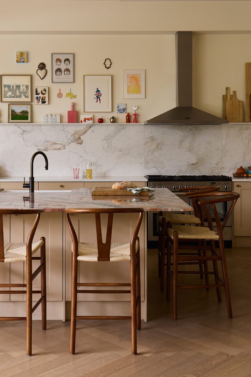 A north London family home with a warm kitchen which includes an island and a gallery wall.
