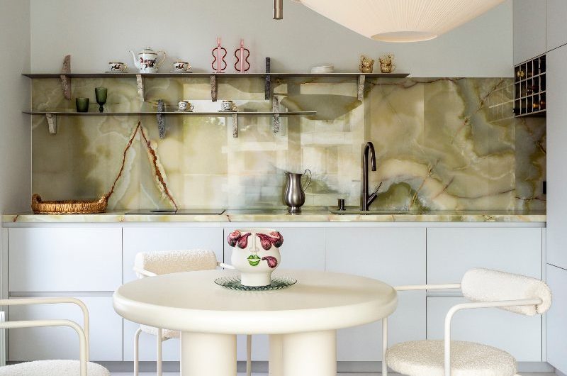 A Polish international kitchen design with a galley kitchen and a quirky dining zone.