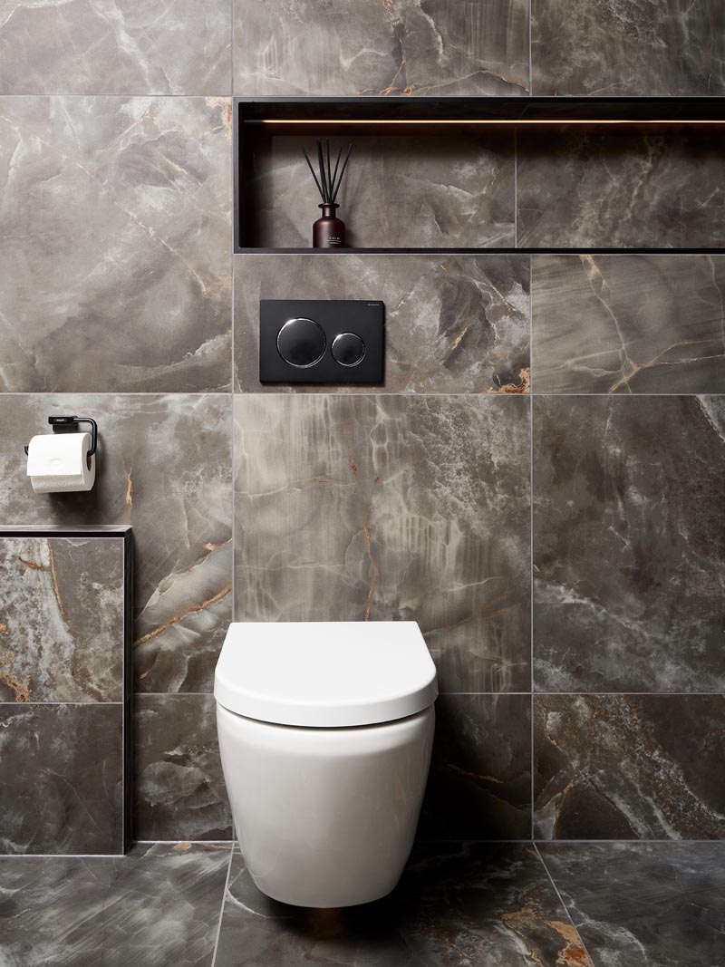 WC area in a modern luxury ensuite near the shower.