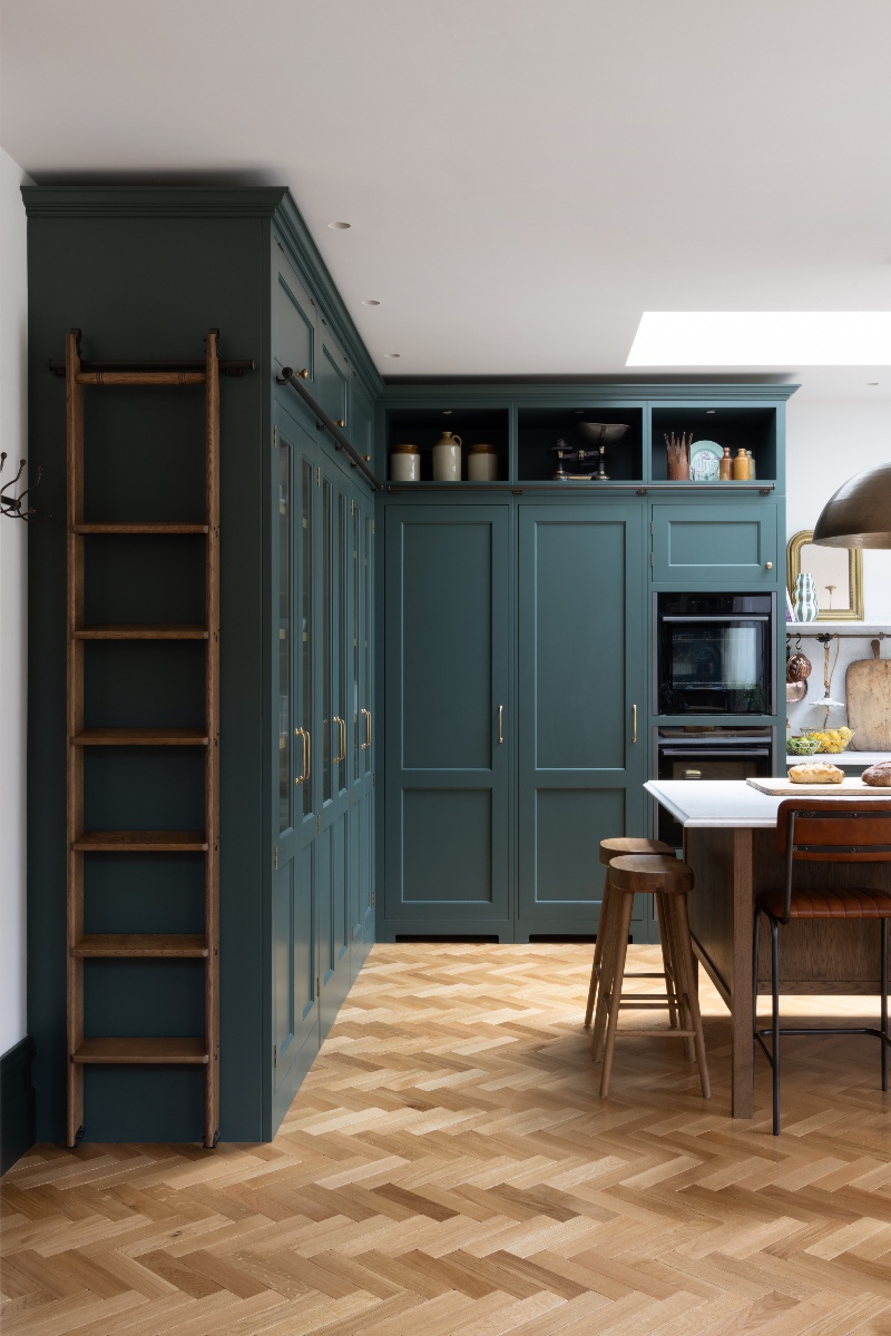 Tour this dark green Shaker kitchen with a secret pantry