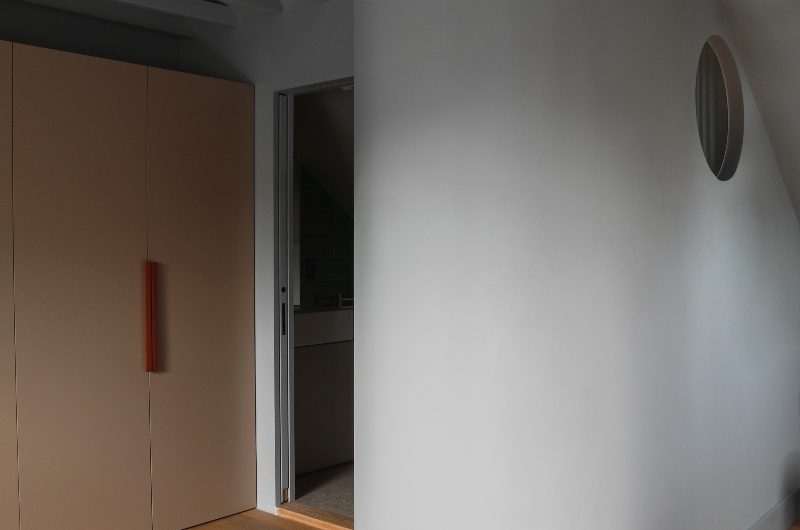 A loft conversion with space for a bedroom and bathroom with a curved wall.