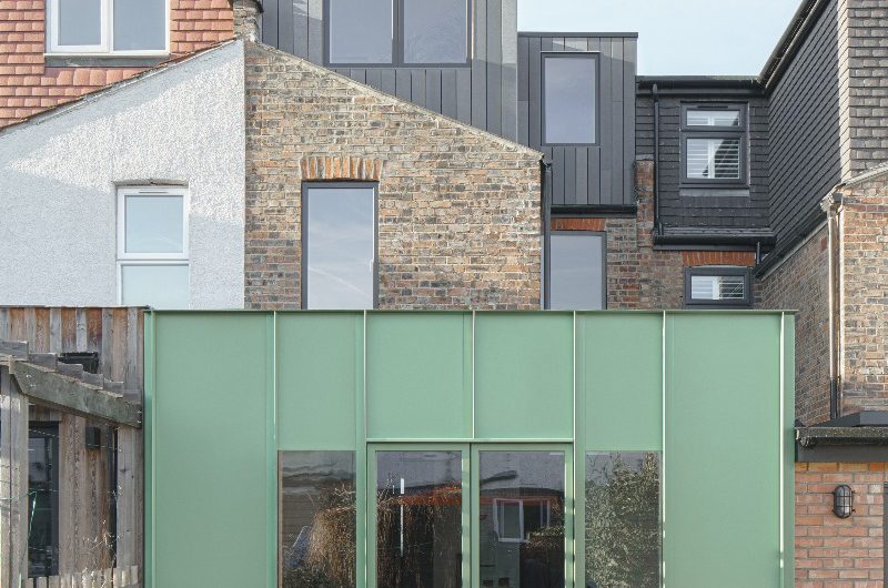 View of a property with a green extension and loft conversion.