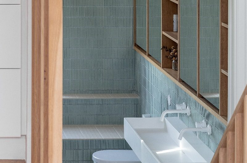 An ensuite bathroom with kit kat tiles and white sanitaryware and brassware.