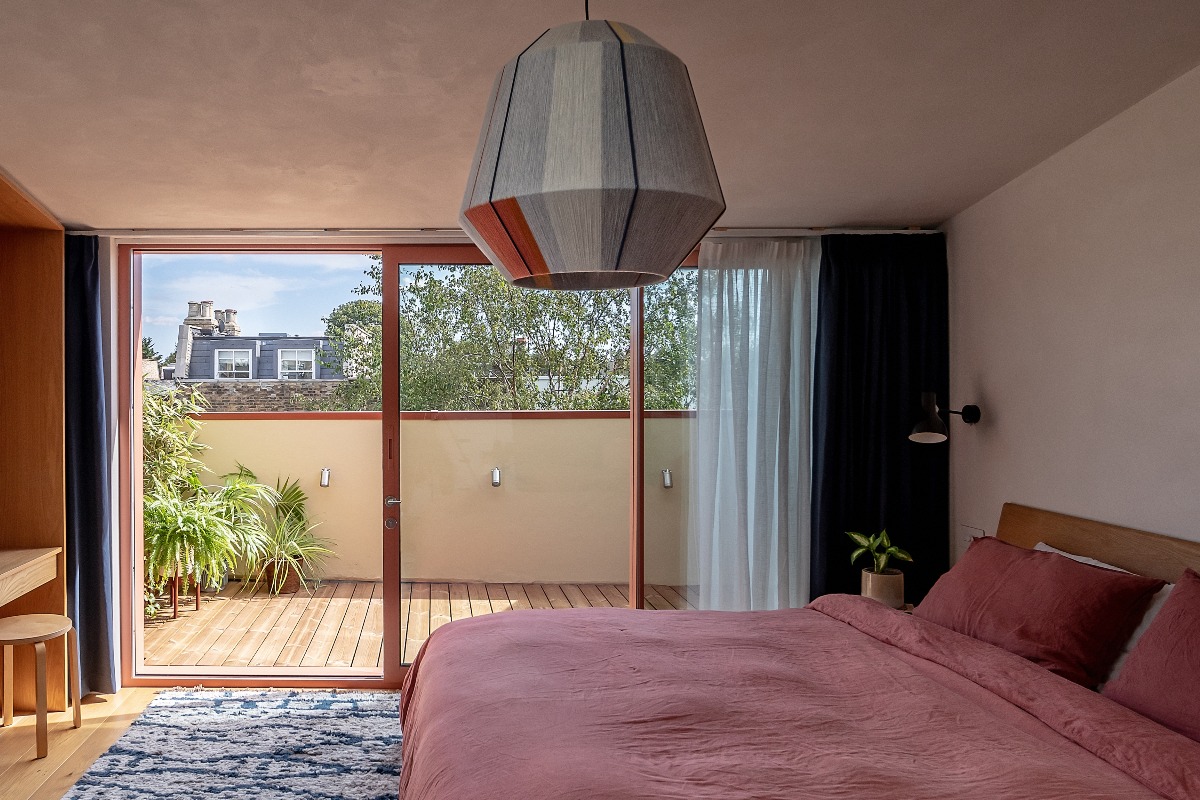 A calming bedroom with a balcony.