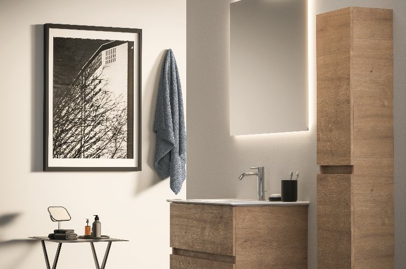 A simple modern bathroom with wall-mounted wood furniture, chrome brassware, LED mirror and minimalist decor.