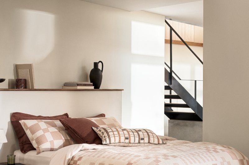 Neutral bedroom trend combining earthy shades, from rich chocolate browns to lighter terracotta and small hits of black and slate grey. 