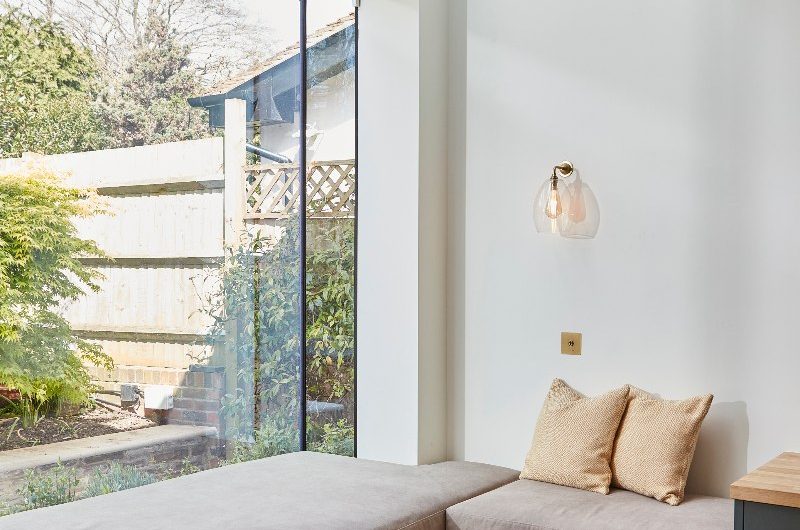Window seat in an L shape with upholstered bench.