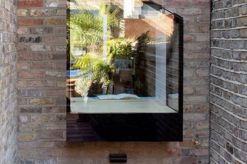 Compact oriel window seat for reading. 