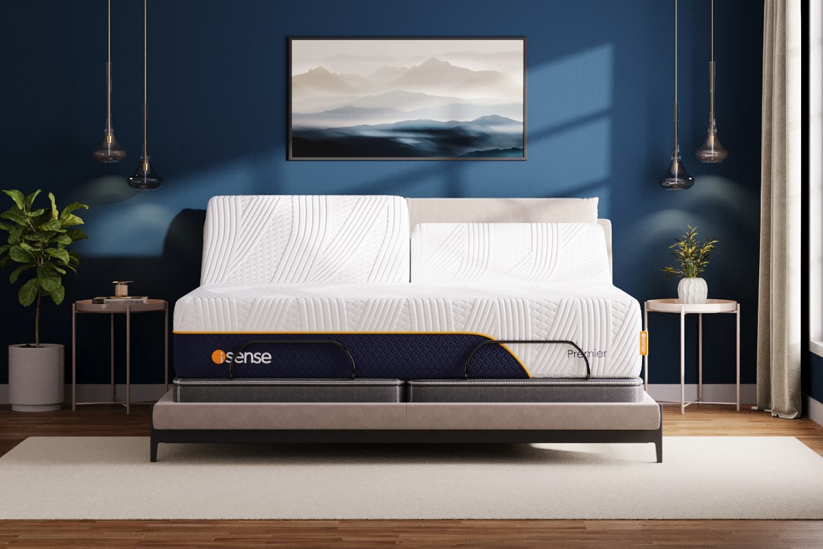 A bed with a hybrid mattress and pillows.