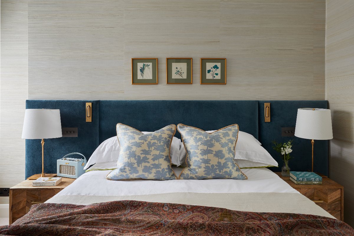 Boutique hotel inspired bedroom with soft greens and turquoise, natural textures and a bespoke velvet headboard.
