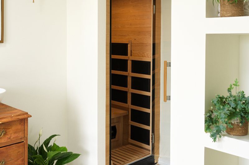 A sauna tucked away in a spa-like bathroom design.