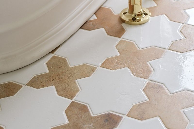 Moroccan-inspired floor tiles in white and a muted stone colour.