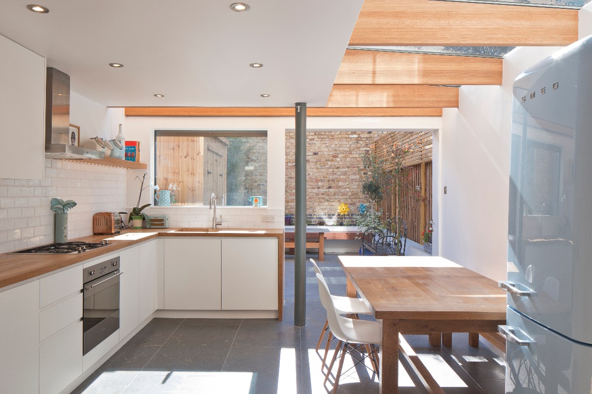 A large living space that flows seamlessly from inside to out through the limestone flooring.