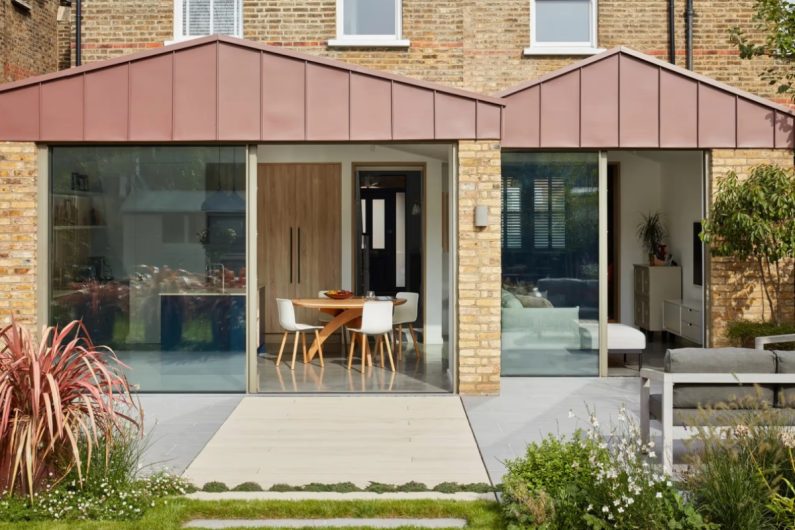 A house with a kitchen extension, glass doors, and a snug.