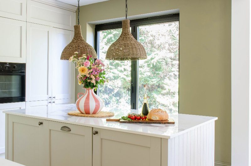 A kitchen island with storage space, and ample worktop for food preparation.