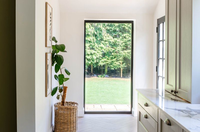A picture window looking out into the graden.