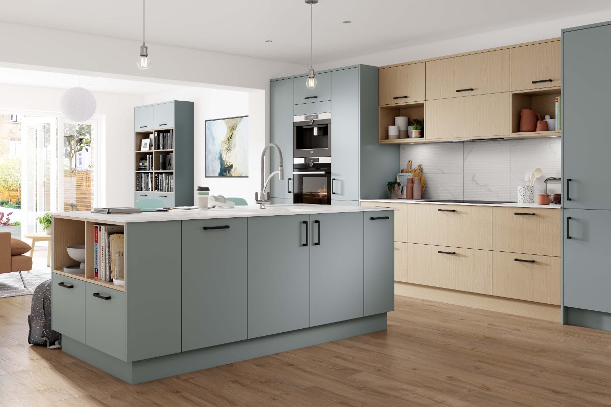 Wood and pale blue cabinetry with a multi-functional island and wood flooring.