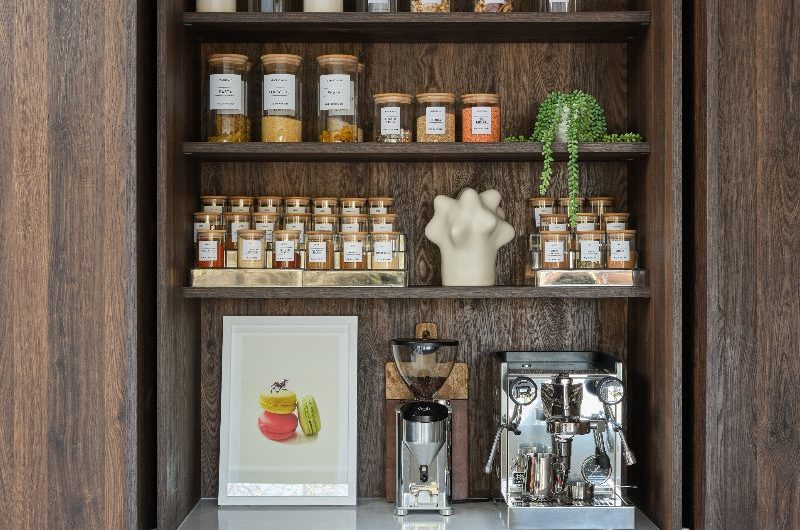 A breakfast cupboard with decanted jars.